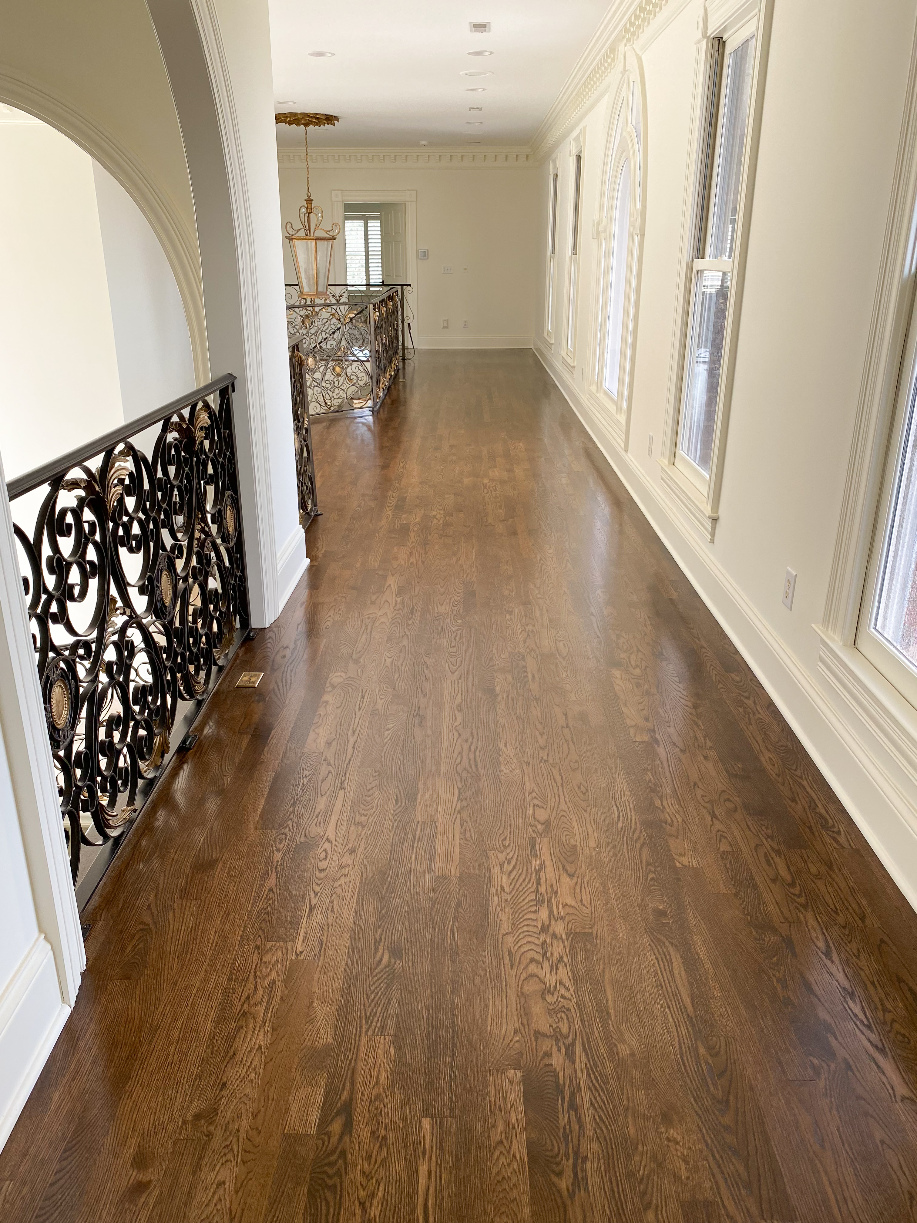 Sitting area with dark refinished hardwood floors